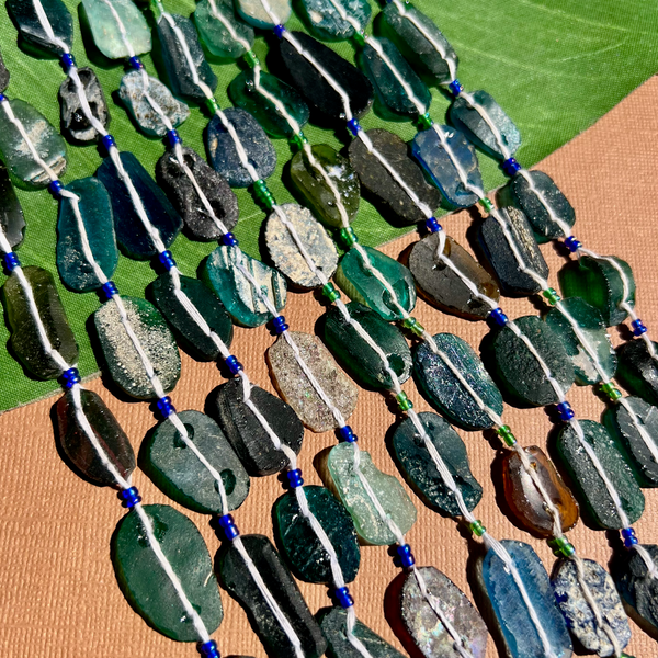 Roman Glass Flat Oval Bead Strands