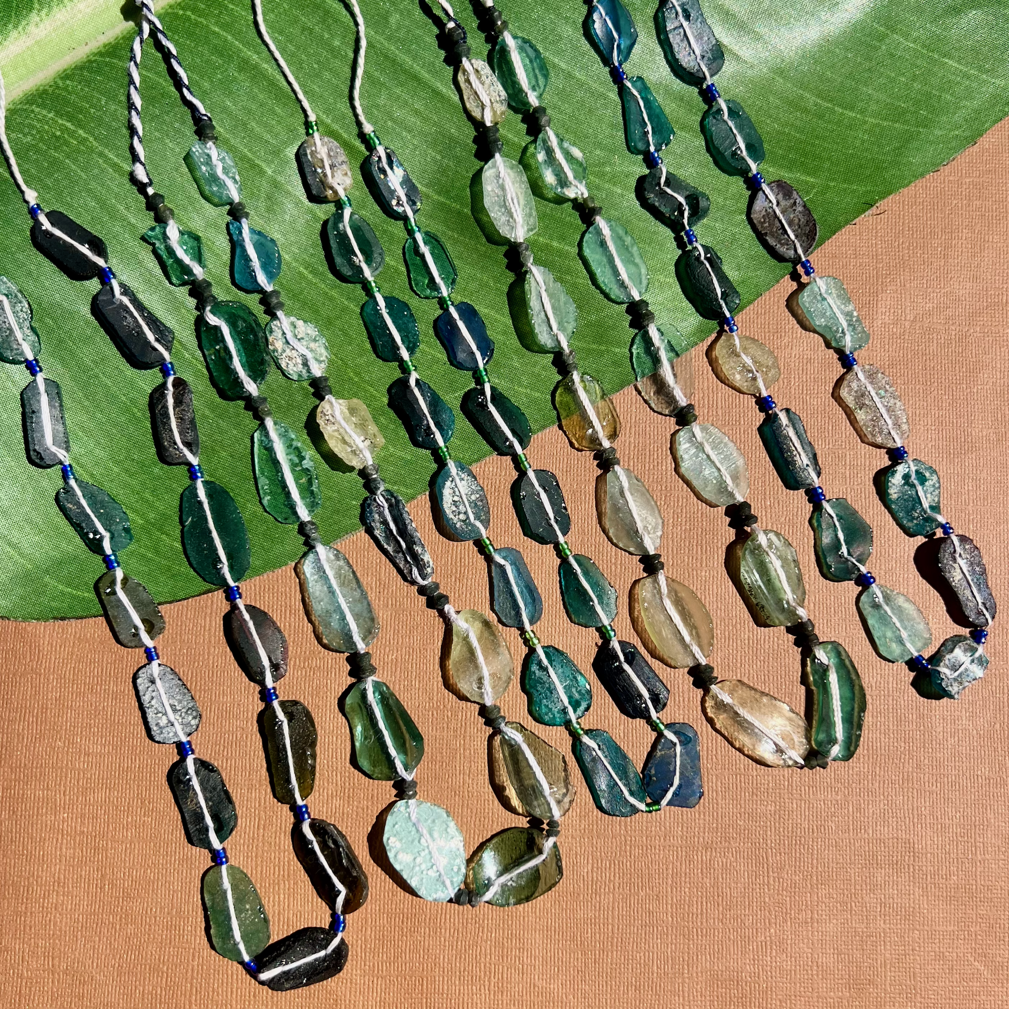 Roman Glass Flat Oval Bead Strands