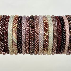 Light pink beaded bangles made from glass seed beads.