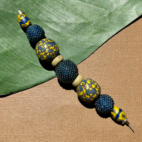 Yellow/Blue Viking glass beads, blue beaded design strand