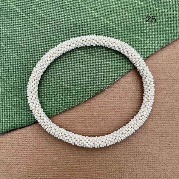 Matte cream size 15  glass seed beads.  Beaded bangle bracelet that can be rolled on.