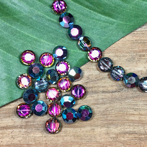 Vintage Swarovski crystals. 12mm round in a pink rainbow and gray finish. 
