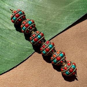Tibetan beads. Brass with turquoise, coral, and lapis. Handmade in Nepal.