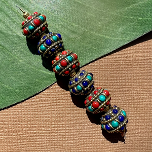 Tibetan beads. Brass with turquoise, coral, and lapis. Handmade in Nepal.