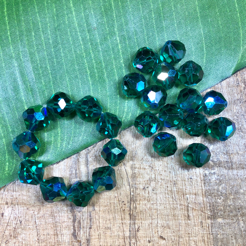 Vintage 14mm green Swarovski crystals from our estate collection. 